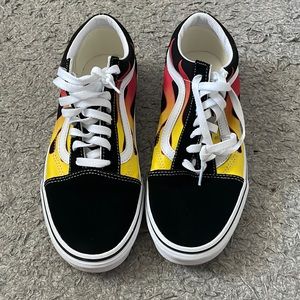 Black low top vans red orange yellow flames on the sides
